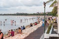 Locals and tourists gather at the foreshore to enjoy and photograph the Balinese sunset