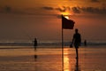 Beach flag at sunset , Kuta Beach, Bali, Indonesia