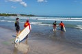 Kuta Beach in Kuta, Bali, Indonesia with People attending a Surf School.