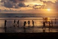 Kuta, Indonesia - March 25, 2019 : Silhouette of locals playing football at sunset Royalty Free Stock Photo