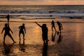 Kuta, Indonesia - March 25, 2019 : Silhouette of locals playing football at sunset Royalty Free Stock Photo