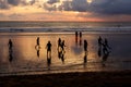 Kuta, Indonesia - March 25, 2019 : Silhouette of locals playing football at sunset Royalty Free Stock Photo