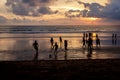 Kuta, Indonesia - March 25, 2019 : Silhouette of locals playing football at sunset