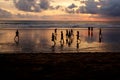 Kuta, Indonesia - March 25, 2019 : Silhouette of locals playing football at sunset Royalty Free Stock Photo