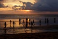 Kuta, Indonesia - March 25, 2019 : Silhouette of locals playing football at sunset Royalty Free Stock Photo