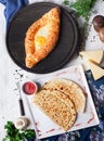 Kutaby and Adjara khachapuri hachapuri with eggs in still life, top view