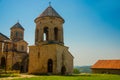 KUTAISI, GEORGIA: View of the old stone Bell Tower in the Orthodox monastery of Gelati on a sunny summer day. UNESCO. Royalty Free Stock Photo