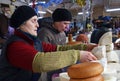 KUTAISI, GEORGIA - January 3, 2017: Women selling homemade and smoked cheese on big food market