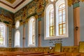 Kutaisi Synagogue inside view of richly decorated side wall and wooden benches