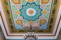 Kutaisi Synagogue inside view of richly decorated roof with colorful geometric and floral pattern paintings.