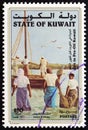 KUWAIT - CIRCA 1998: A stamp printed in Kuwait from the `Life in Pre-Oil Kuwait` issue shows pearl divers wading out to boat