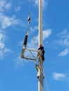 115kV Disconnecting switch installation by the workers and the crane truck lifting to the installation point Royalty Free Stock Photo