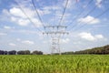 150KV high voltage pylons through a field at Hattemerbroek Royalty Free Stock Photo