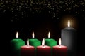 Kwanzaa holiday background with candle light of seven candle sticks in black, green, red symbolising 7 principles of African Royalty Free Stock Photo