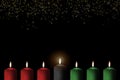 Kwanzaa holiday background with candle light of seven candle sticks in black, green, red symbolising 7 principles Royalty Free Stock Photo