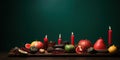 Kwanzaa, traditional table decorations with fruits and red candles, banner, copy space Royalty Free Stock Photo