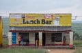 Kwazulu Natal, South Africa. Lunch Bar, cafe, take away with yellow sign, photographed in a rural village.