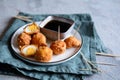 Kwek Kwek - deep fried quail eggs coated with batter served with soya sauce and vinegar dip Royalty Free Stock Photo