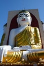 Big sitting Buddha at Kyaikpun Pagoda. Bago. Myanmar