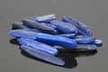 Natural blue kyanite stones on dark background