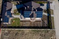 Kyiv- Dec 11 ,2019: Aerial top view of a private house with paved yard with green grass lawn with concrete foundation floor