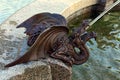 Detailed view of scenic bronze sculpture of dragon. Decoration of new fountain in city in