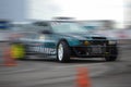 Classic BMW M3 E36 drifting on high speed on race track with blurred motion effect on Drift And Car Show Royalty Free Stock Photo
