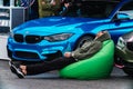 Tuned BMW M4 F83 wrapped in chrome metallic blue vinyl wrap, exhibited on Drift And Car Show Royalty Free Stock Photo