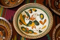 Kyiv-Pechersk Lavra museum, Ukraine - 07.06.2016: ancient Ukrainian handmade and handpainted ceramic clay plate