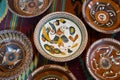 Kyiv-Pechersk Lavra museum, Ukraine - 07.06.2016: ancient Ukrainian handmade and handpainted ceramic clay plates
