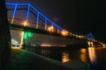 Kyiv pedestrian bridge illuminated with different colors