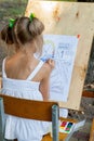 Kyiv - September 2019: Girl draws a coloring book with until September 1
