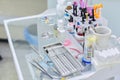 Kyiv UA, 31-07-2019. Close-up of working desk in dentist office with dental composite sealing materials Royalty Free Stock Photo