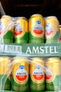 Kyiv, Ukraine 28.07.2023: - Amstel beer brand stacked in tin cans on shelw in supermarket