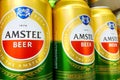 Kyiv, Ukraine 28.07.2023: - Amstel beer brand stacked in tin cans on shelw in supermarket