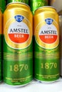 Kyiv, Ukraine 28.07.2023: - Amstel beer brand stacked in tin cans on shelw in supermarket