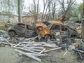 Damaged burned cars in the aftermath of a shelling in Podilskyi district of Kyiv. War in Ukraine