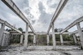 Abandoned unfinished concrete roofless hangar in cloudy day Royalty Free Stock Photo