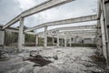 Abandoned unfinished concrete roofless hangar in cloudy day Royalty Free Stock Photo