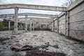 Abandoned unfinished concrete roofless hangar in cloudy day Royalty Free Stock Photo