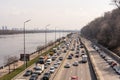 Kyiv, Ukraine- April 1, 2021: Automobile collapse at the highway along Dnipro River. Traffic jam with rows of cars on