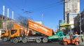 Kyiv, Ukraine - April, 29 2023, Construction site is laying new asphalt road pavement,road construction workers and road Royalty Free Stock Photo