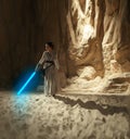 Cosplayer girl portrays character Rey Skywalker from the Star Wars universe with lightsaber in her hand among sandy canyon