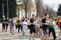 Kyiv - Ukraine, April 07, 2019: Crowd of People and Athletes Runners Run along the Road in the City