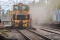 Kyiv Ukraine - April 27 2020: A huge dust cloud in the center of a big city during the operation of the auxiliary railway machine