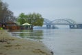 Landscape view of high water in Kyiv, spring 2023. Some part of the sand beach with gazebos are flooded Royalty Free Stock Photo