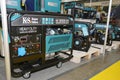 Large shop display of home standby diesel, backup generators to deliver electricity during power