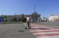 People on Kontraktova Square in Kyiv on a sunny spring day