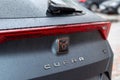 Kyiv, Ukraine. April, 2024. The Seat Cupra logo on a car in gray close-up with water drops