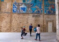 Visitors to the River Station are photographed against the background of famous frescoes and mosaic panels. Kyiv Ukraine